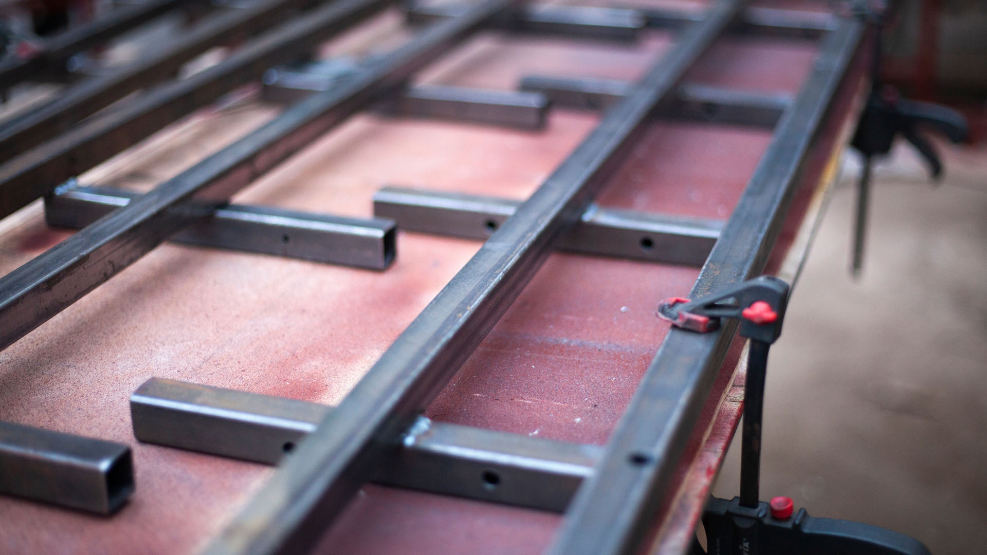 Close-up of precision welding sparks on a steel joint